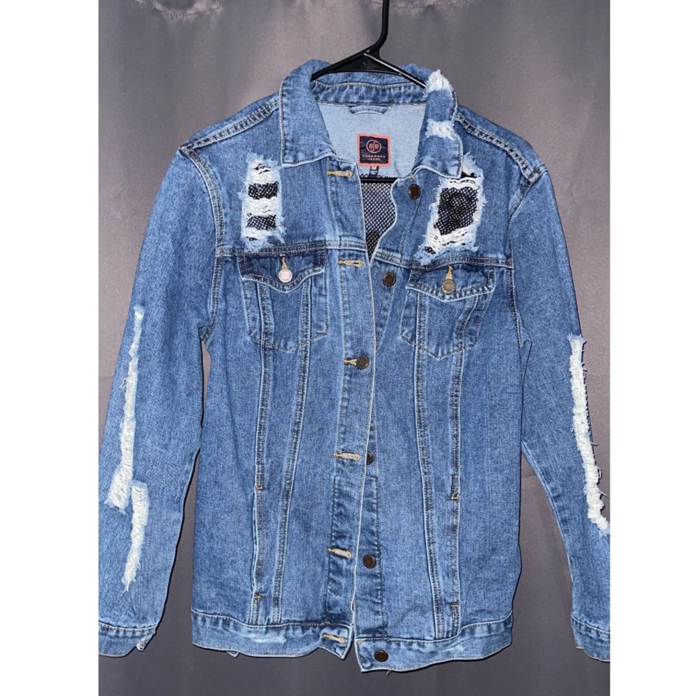 Ripped denim jacket with fishnet